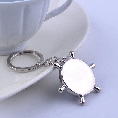 TG rudder compass keychain size view, 100 x 50 mm